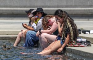 People cool off amid a dangerous heat wave afflicting the eastern half of the United States in Washington
