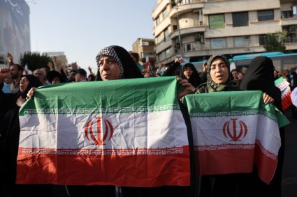 People attend a protest against the U.S attack on nuclear sites, in Tehran, Iran