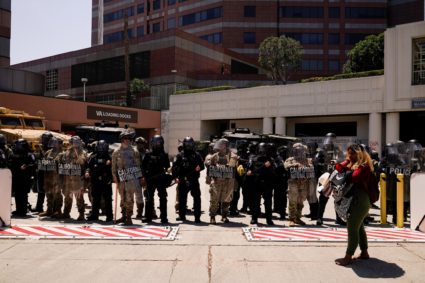 Members of the California National Guard stand guard in downtown Los Angeles