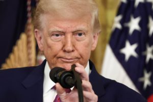 U.S. President Trump signs a resolution at the White House