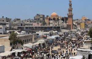 Palestinians gather to receive aid supplies in Khan Younis