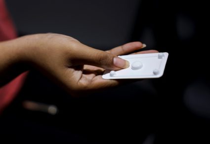 A patient prepares to take Mifepristone, the first medication in a medical abortion, at Alamo Women's Clinic in Carbondale