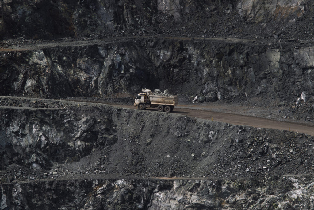 A truck transports rocks containing chrysotile, or white asbestos, to a processing plant at the Cana Brava mine in Minacu