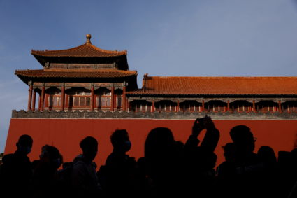 Local tourists queue to enter the Forbidden City in Beijing