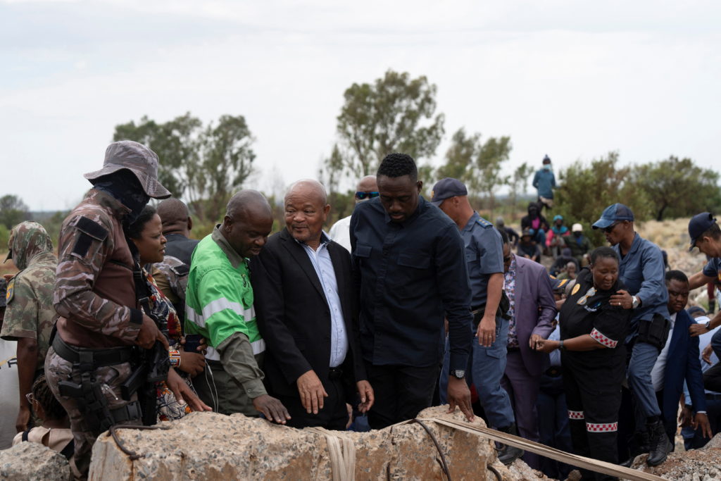 South African police in standoff with hundreds of illegal miners in disused shaft