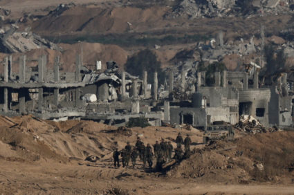 Israeli soldiers operate in Gaza, as seen from Israel