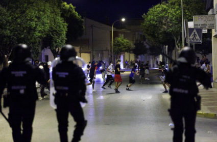Police detain 8 people after anti-migrant clashes in Spanish town