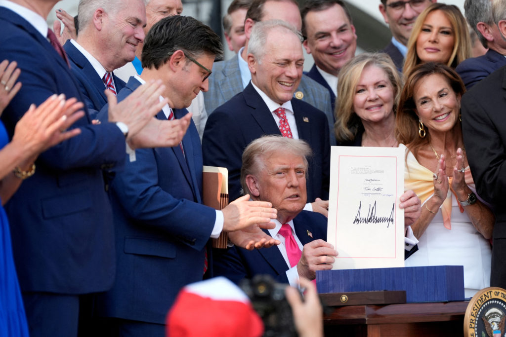 FILE PHOTO: U.S. President Trump signs the "One Big Beautiful Bill Act" in Washington