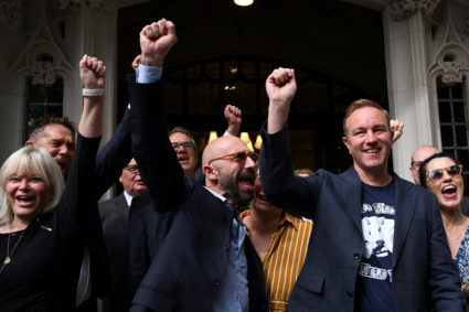 Former UBS and Citigroup trader Tom Hayes and former Barclays trader Carlo Palombo celebrate after their conviction for ma...