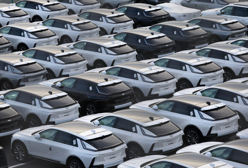 U.S. automaker General Motors' Cadillac vehicles are lined up at a vehicle storage yard at an industrial port in Yokohama