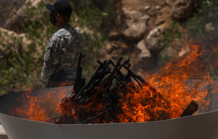 Kurdish separatist fighters in Iraq begin laying down weapons as part of peace process with Turkey