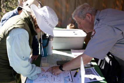 National Park Service Seasonal Interpretation Ranger Steve Northup suggests hiking routes to visitors in Yellowstone Natio...