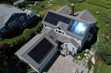 Solar panels create electricity on the roof of a house in Rockport