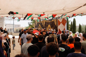 Mourners take part in the funeral of of Sayfollah Kamel Musallet, killed amid the Israel-Gaza conflict, near Ramallah