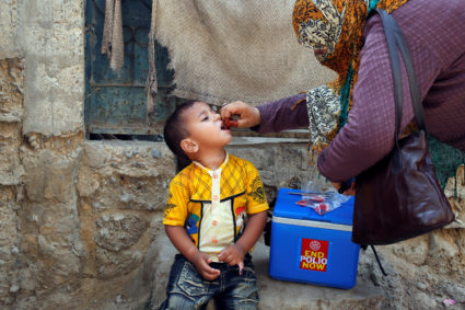 Boy receives polio vaccine drops during an anti-polio campaign in Karachi