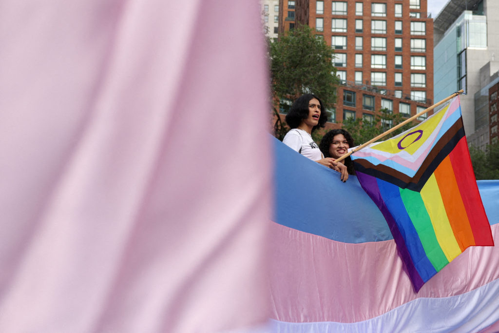 FILE PHOTO: People gather after the U.S. Supreme Court upheld a Tennessee law banning some medical care for transgender yo...