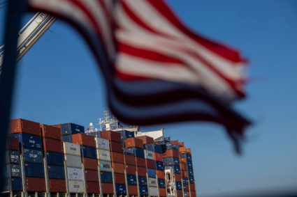 A cargo ship full of shipping containers is seen at the port of Oakland, California