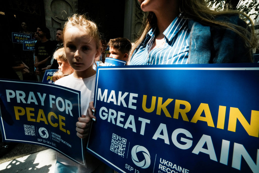 People attend a 'Rally for Peace’ at Saint George Ukrainian Catholic Church in New York