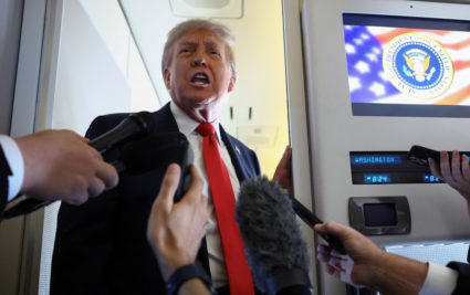 Trump speaks to reporters aboard Air Force One before meeting with Putin in Alaska to discuss an end to the war in Ukraine