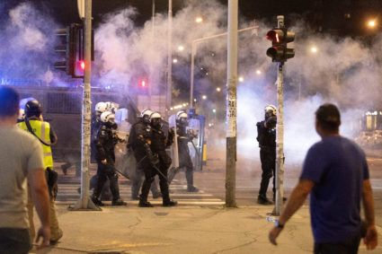 Tensions soar in Serbia as angry protesters clash with police and set fire to party offices
