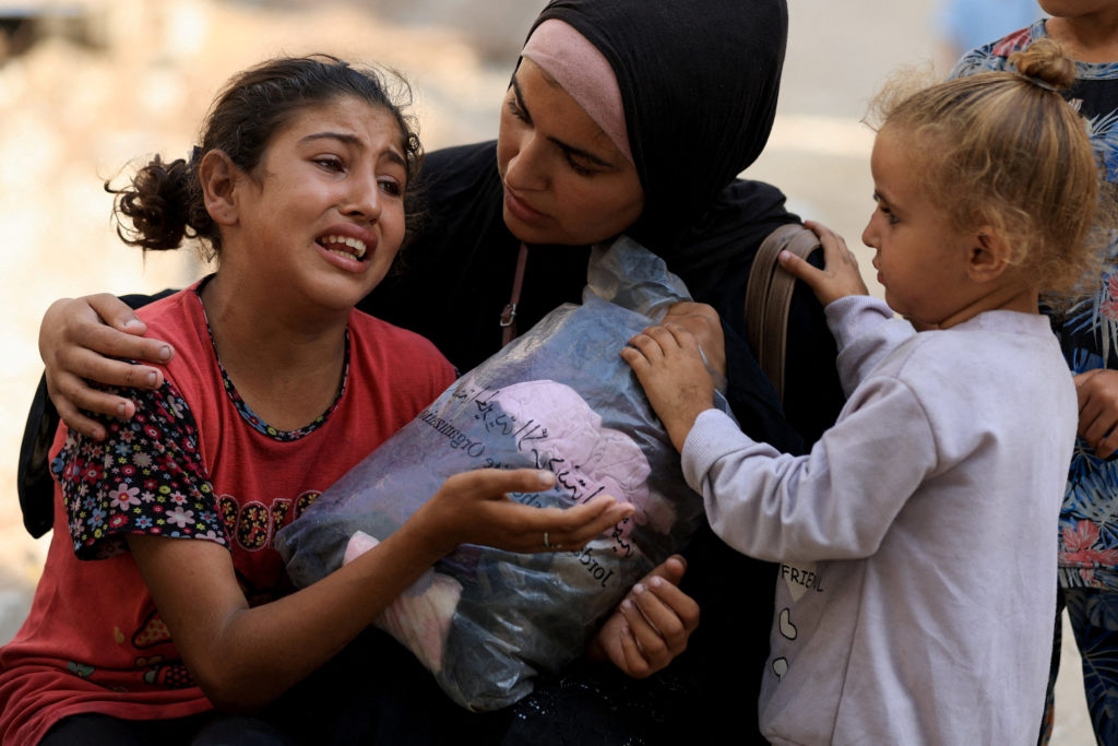 Palestinians mourn loved ones killed in Israeli strikes