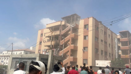 Palestinians inspect the site of Israeli strikes on Nasser Hospital where Reuters contractor was killed, in Khan Younis