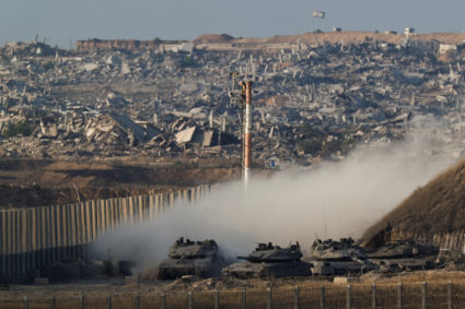Israeli tanks manoeuvre on the border with Gaza