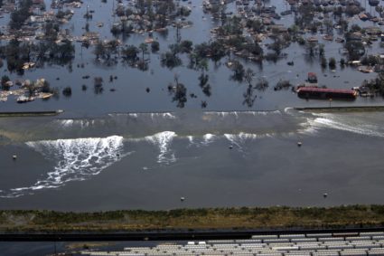 A levee gives way to high water after hurricane Katrina struck in New Orleans, Louisiana.