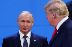 FILE PHOTO: FILE PHOTO: Putin and Trump are pictured in 2018 in Argentina