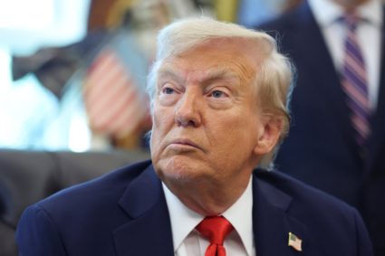 U.S. President Donald Trump signs executive orders in the Oval Office at the White House in Washington