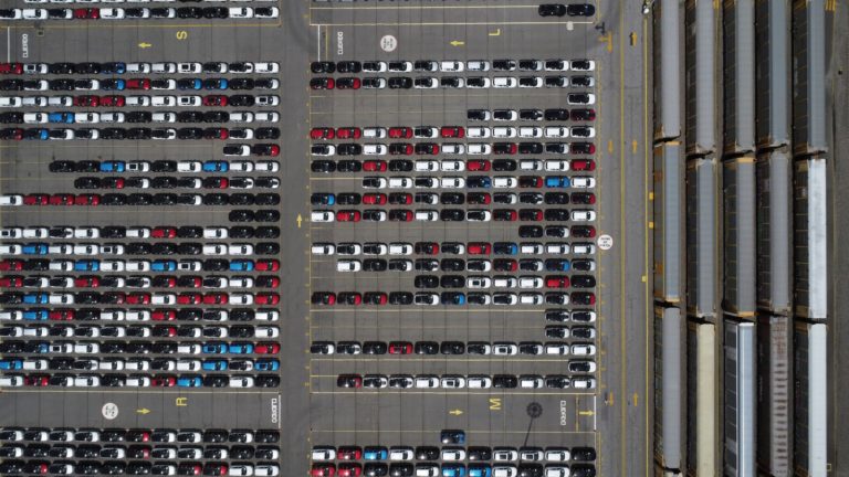 A drone view shows new vehicles at a rail yard in Santa Ana Tlapaltitlan