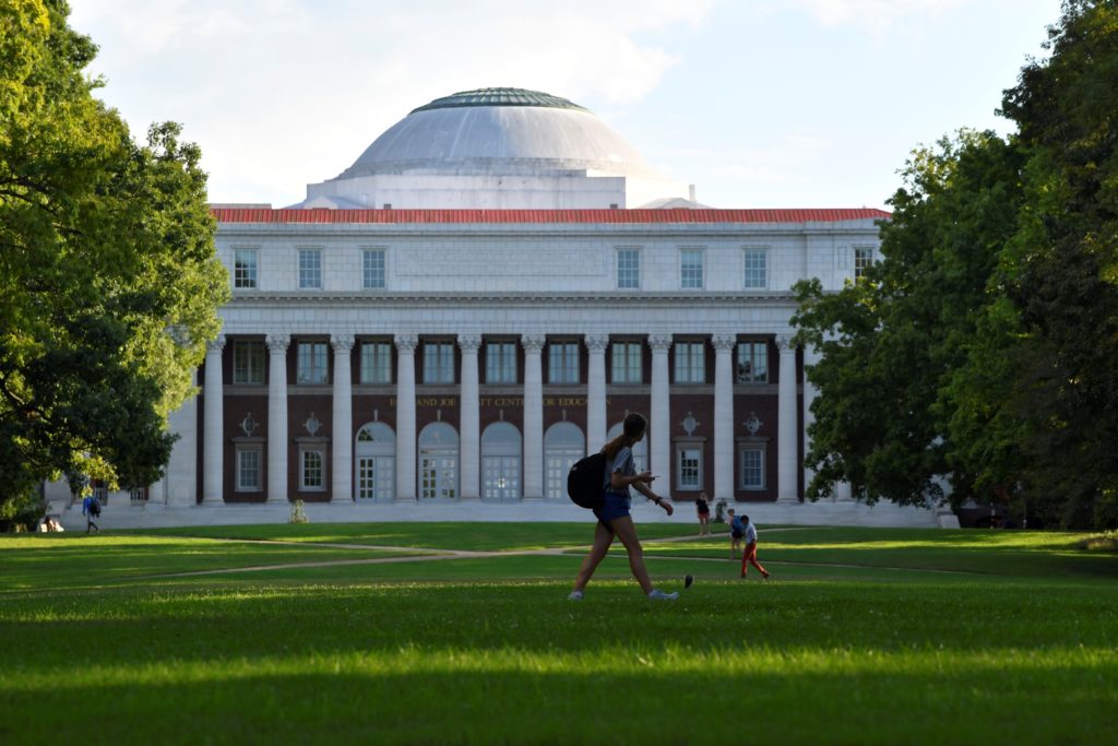 Students crossing the lawn in front of the Faye and Joe Wyatt Center for Education on the campus of Peabody College at Van...