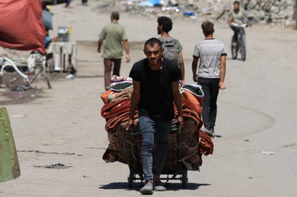 Displaced Palestinians flee from one area to another within Gaza City, amid an Israeli military operation