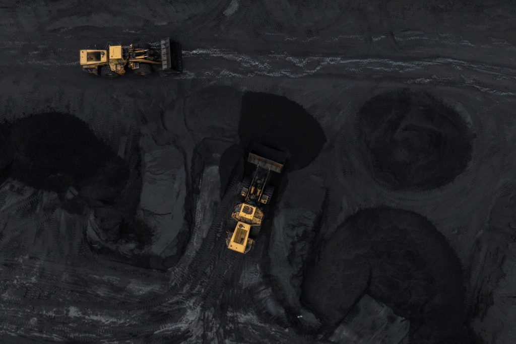 Bulldozers arrange coal at the SunCoke Jewell facility in Oakwood, Virginia