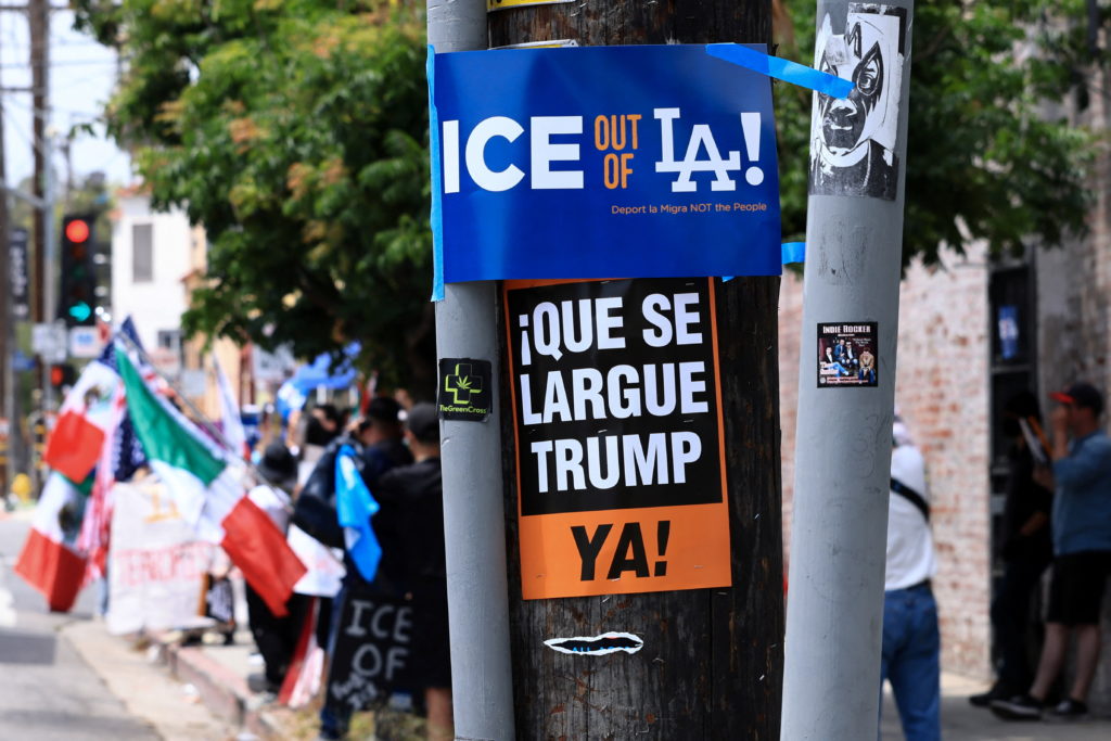 Dodgers fans protest against the U.S. Immigration and Customs Enforcement (ICE) and federal immigration sweeps in Los Angeles