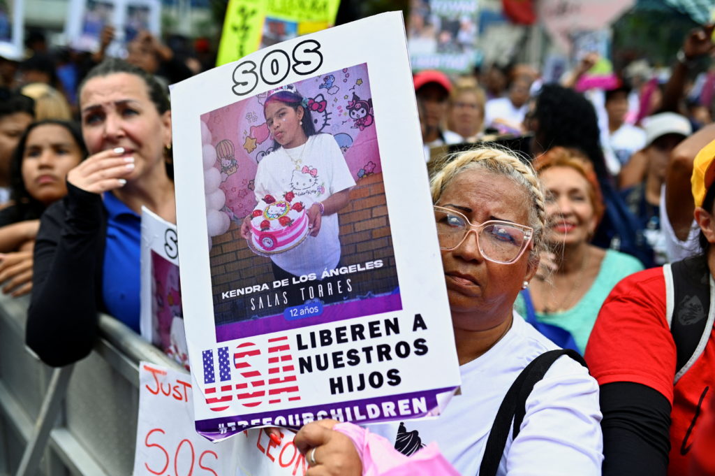 Demonstrators march to demand the return of Venezuelan migrant children after their parents were deported from the U.S., i...