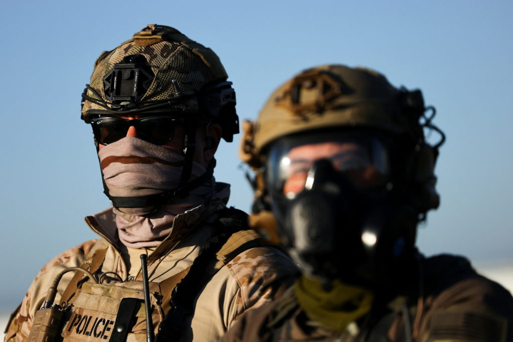 U.S. federal agents and immigration officers raid an agricultural facility in Camarillo