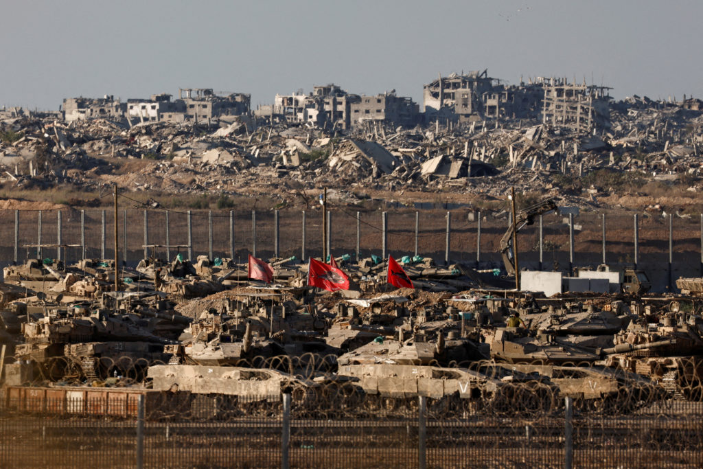 FILE PHOTO: Israeli tanks stand in the Israeli side of the border with Gaza