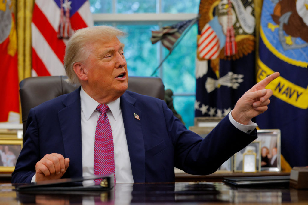 U.S. President Donald Trump signs an executive order at the White House in Washington, D.C.
