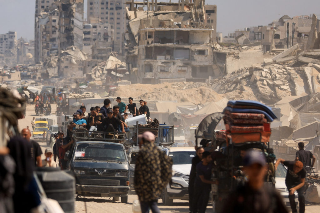 Displaced Palestinians flee following an Israeli evacuation order, in Gaza City