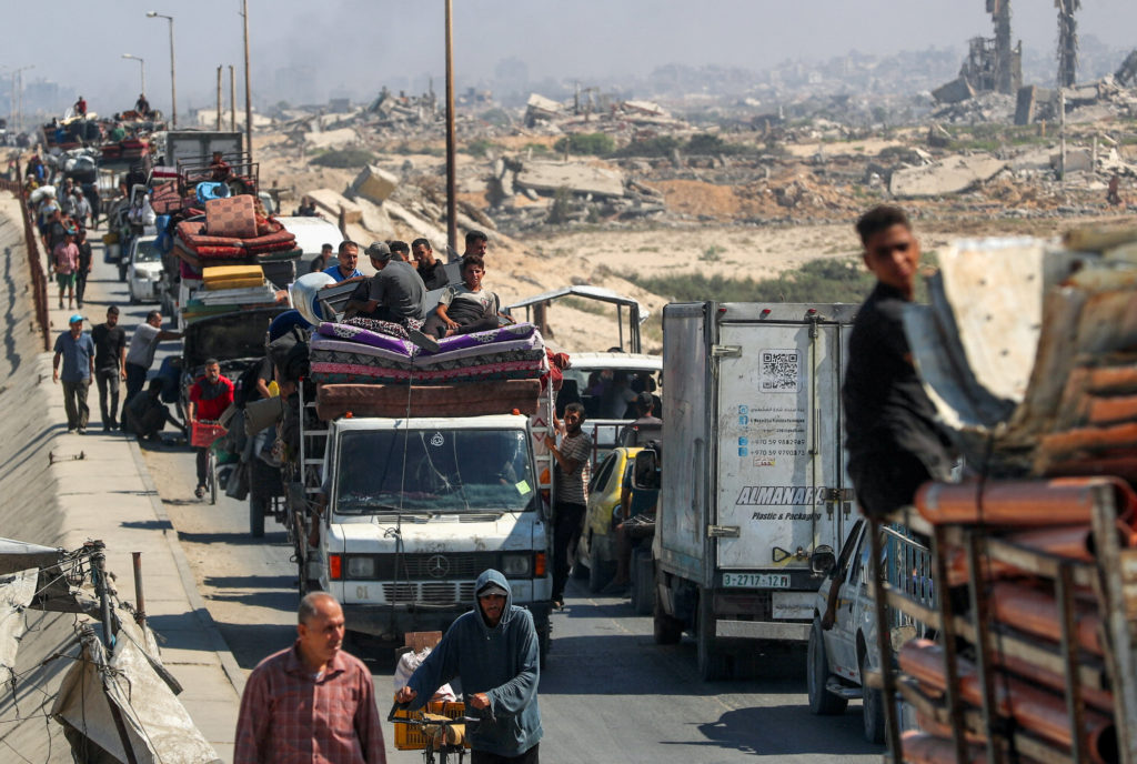 Displaced Palestinians, fleeing northern Gaza move southward, in the central Gaza Strip