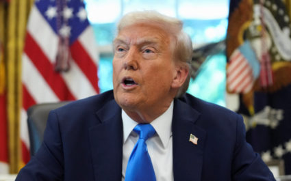U.S. President Donald Trump signs executive orders in the Oval Office at the White House in Washington