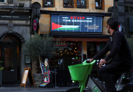 A person rides a bicycle past Palestine House, as Britain’s Prime Minister Keir Starmer has announced the United Kingdom h...
