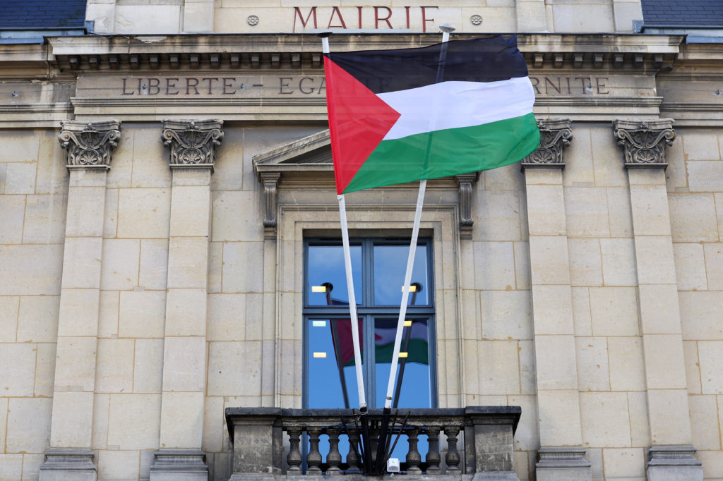 The Palestinian flag flies on the facade of city hall in Saint-Ouen