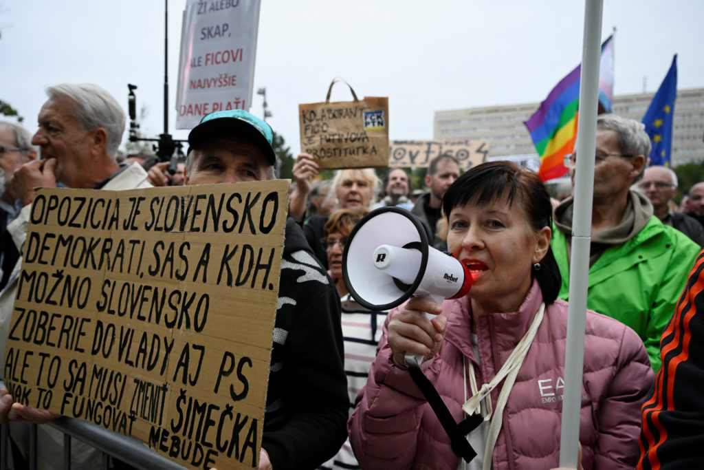 People attend an anti-government protest in Bratislava