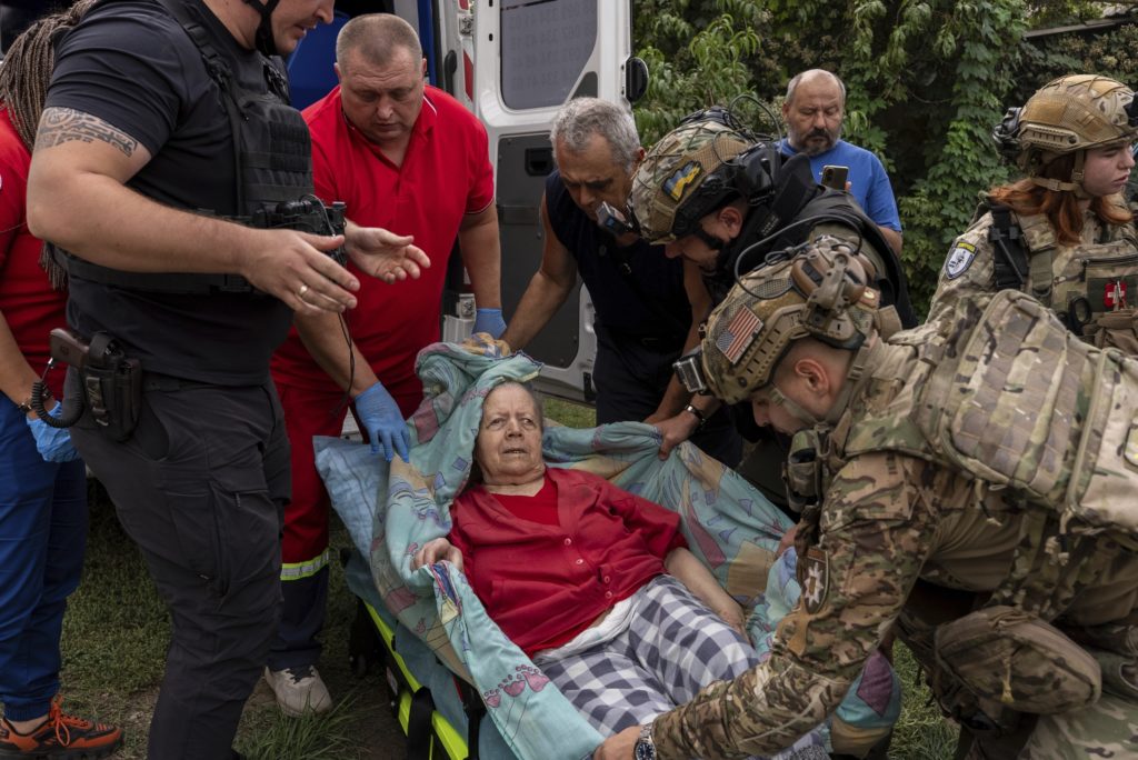 Russian glide bomb attack in eastern Ukraine kills at least 24 people waiting to collect pensions