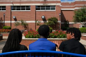 Students sit on a bench on the campus of HBCU Tennessee State University