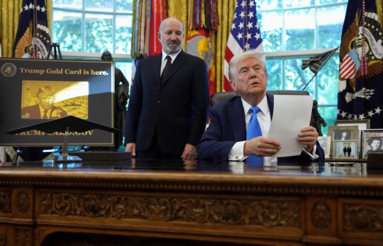 U.S. President Donald Trump signs executive orders in the Oval Office at the White House in Washington