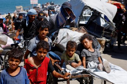 Displaced Palestinians move southward after Israeli forces ordered residents of Gaza City to evacuate to the south