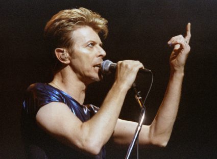 Singer David Bowie gestures as he performs one of the the first songs of a six-week concert tour of..